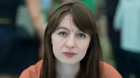 Sally Rooney claims she is unable to travel to the UK due to legal concerns